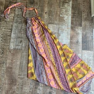 Never worn. Beautiful scarf like halter dress